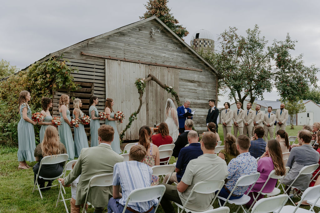 A photo of Gunflint Acres wedding ceremony with attendees