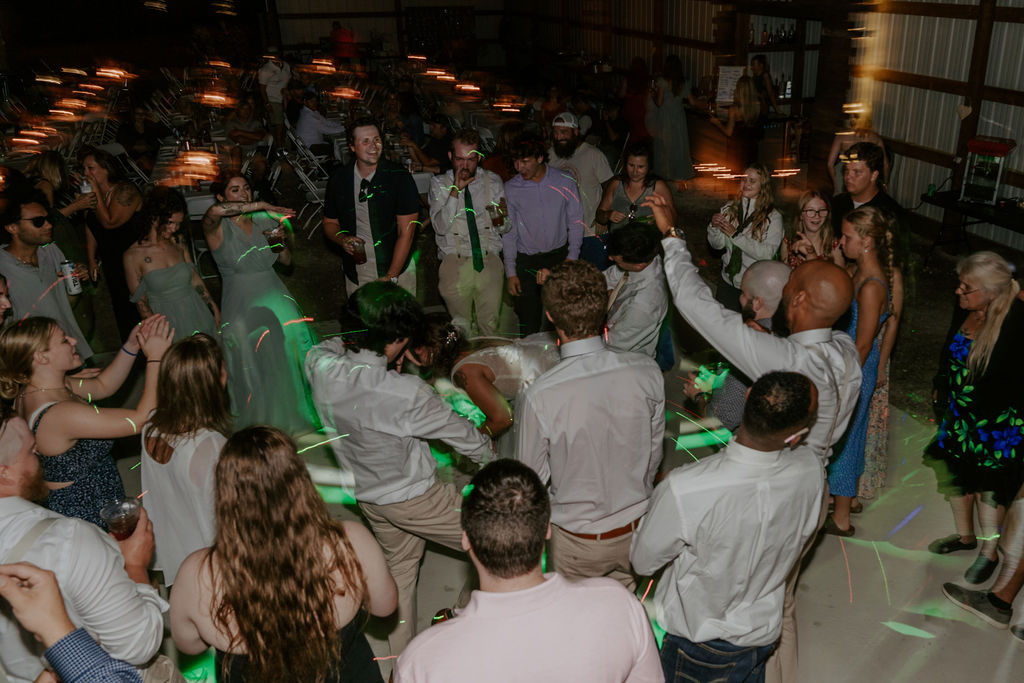 A photo of people dancing at Gunflint Acres after party celebration